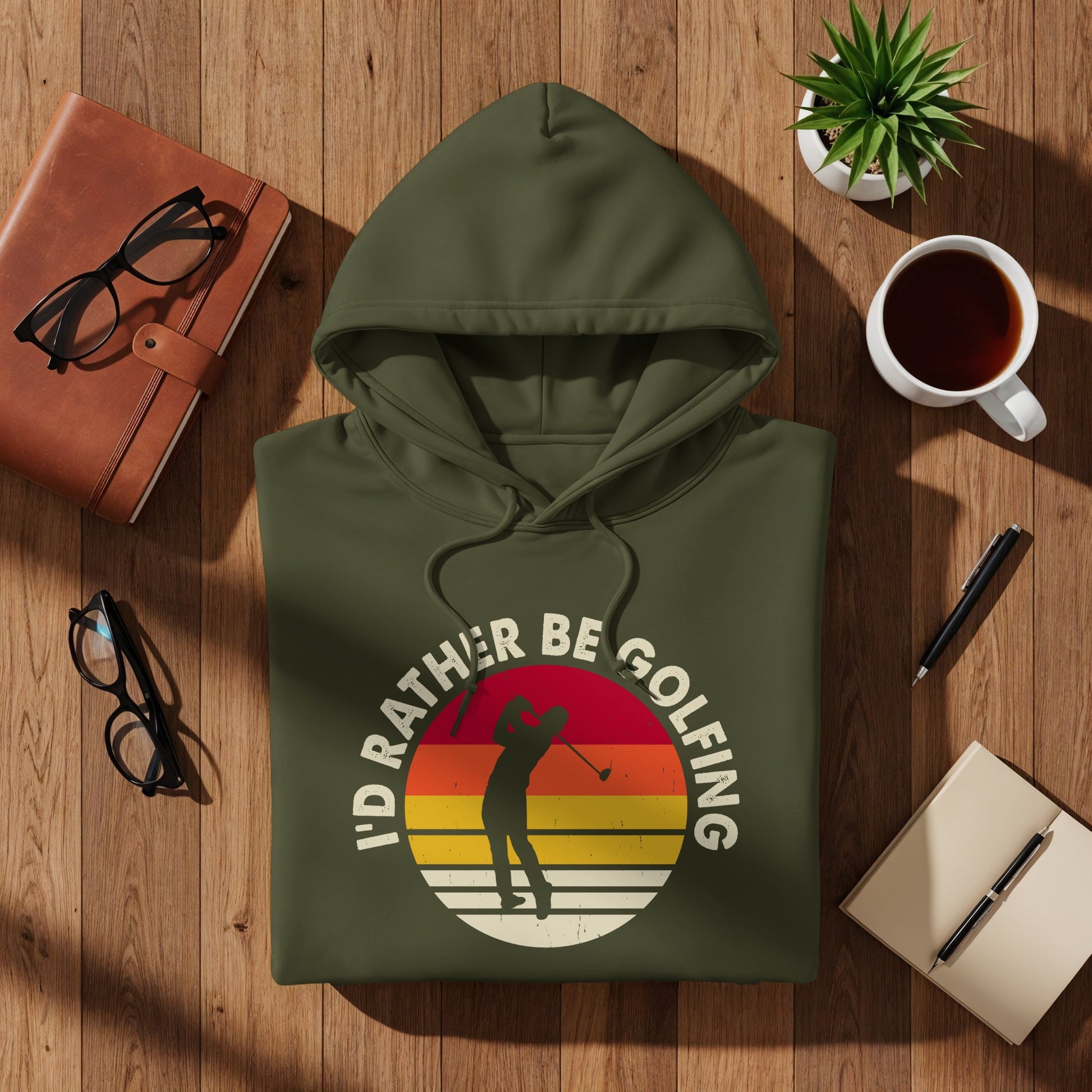 Green hoodie with "I'd rather be golfing" text and golfer silhouette.
