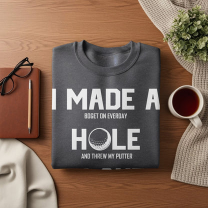 Dark gray sweatshirt with white text reading "I made a bogey on everyday and threw my putter."
