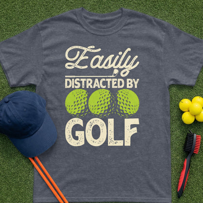 T-shirt with "Easily Distracted By Golf" text and golf ball graphics.
