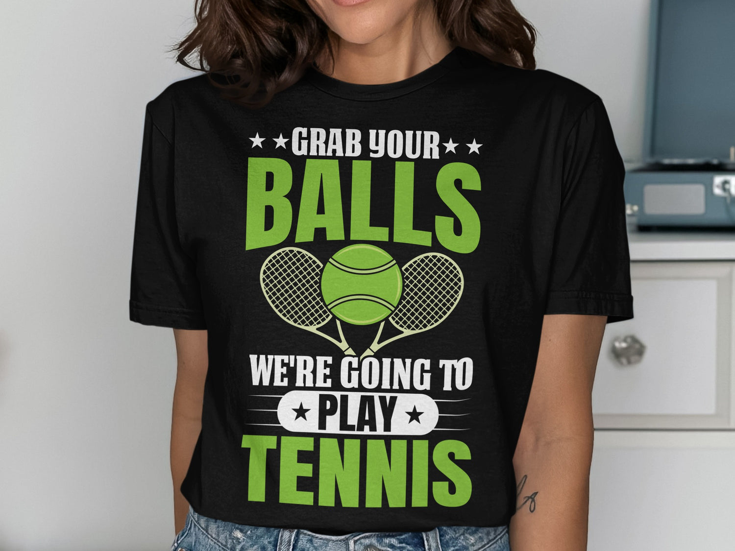 T-shirt with "Grab Your Balls We're Going to Play Tennis" text and tennis graphics.