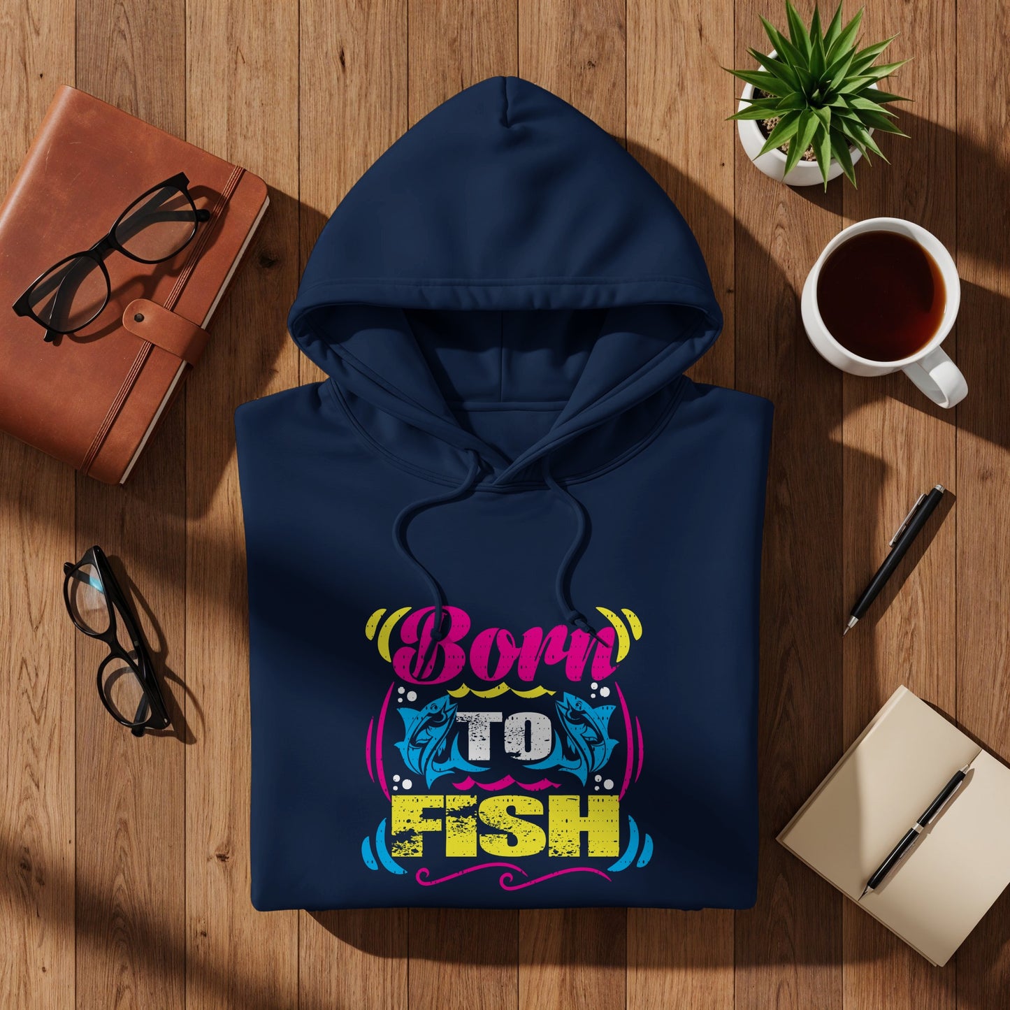 Navy hoodie with "Born to Fish" graphic featuring fish and vibrant lettering.
