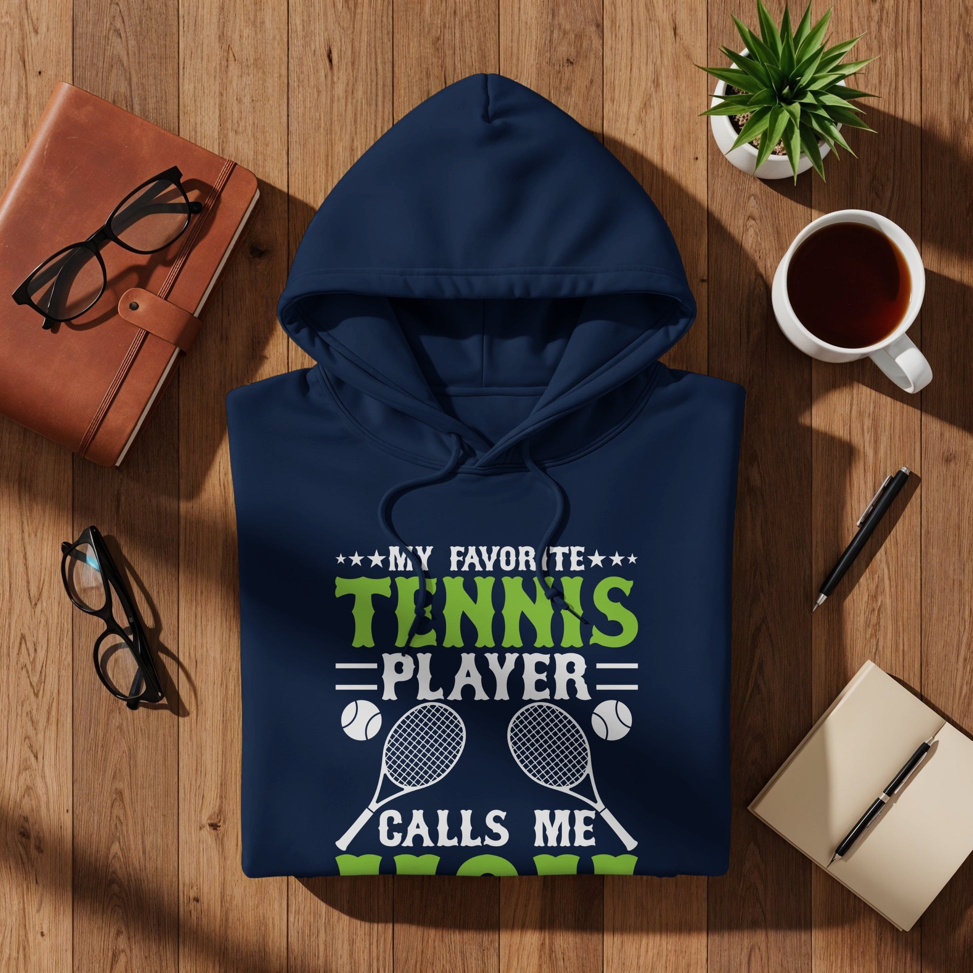 Navy hoodie with "MY FAVORITE TENNIS PLAYER CALLS ME MOM" text and racquets.