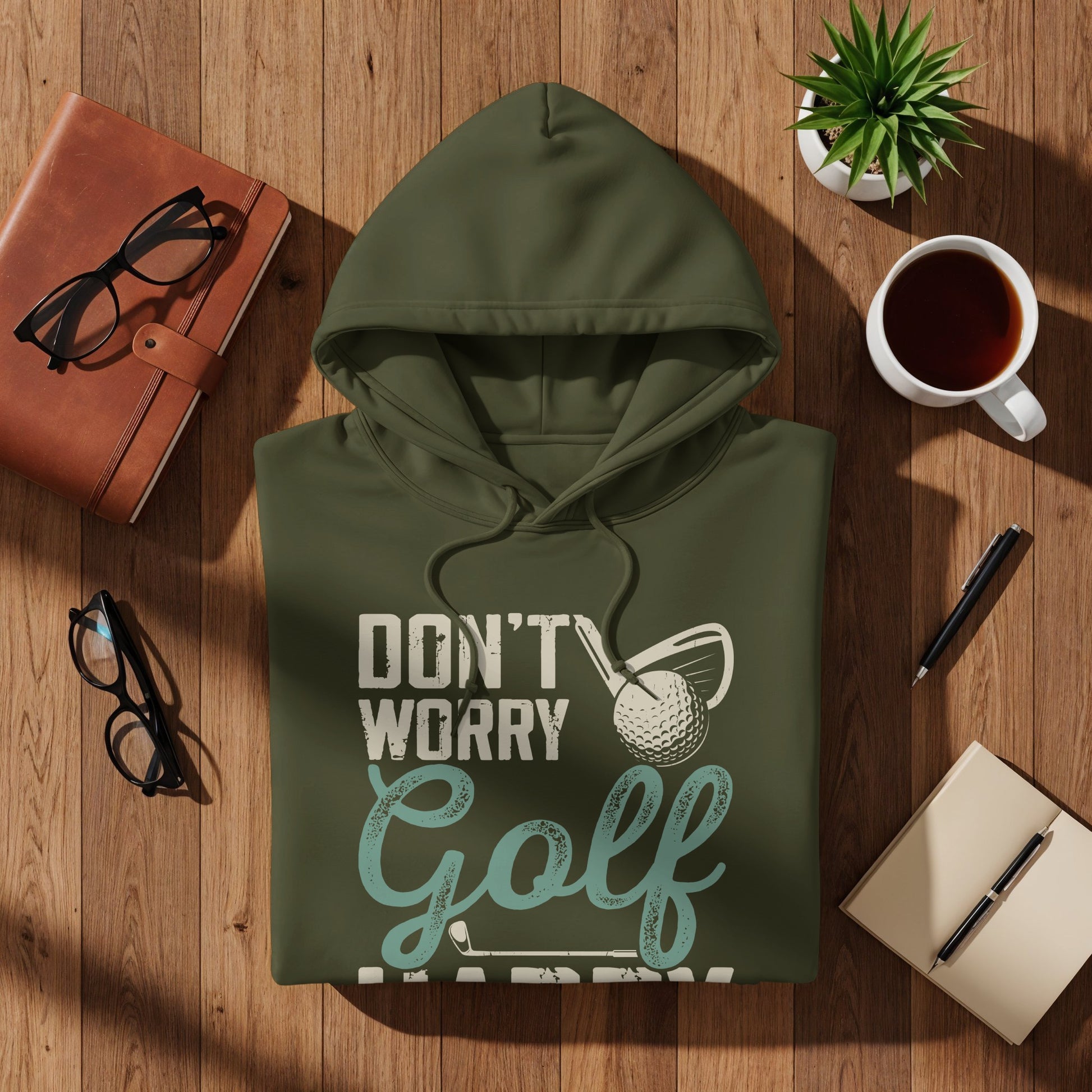 Green hoodie with "Don't Worry Golf Happy" text and golf ball graphic.