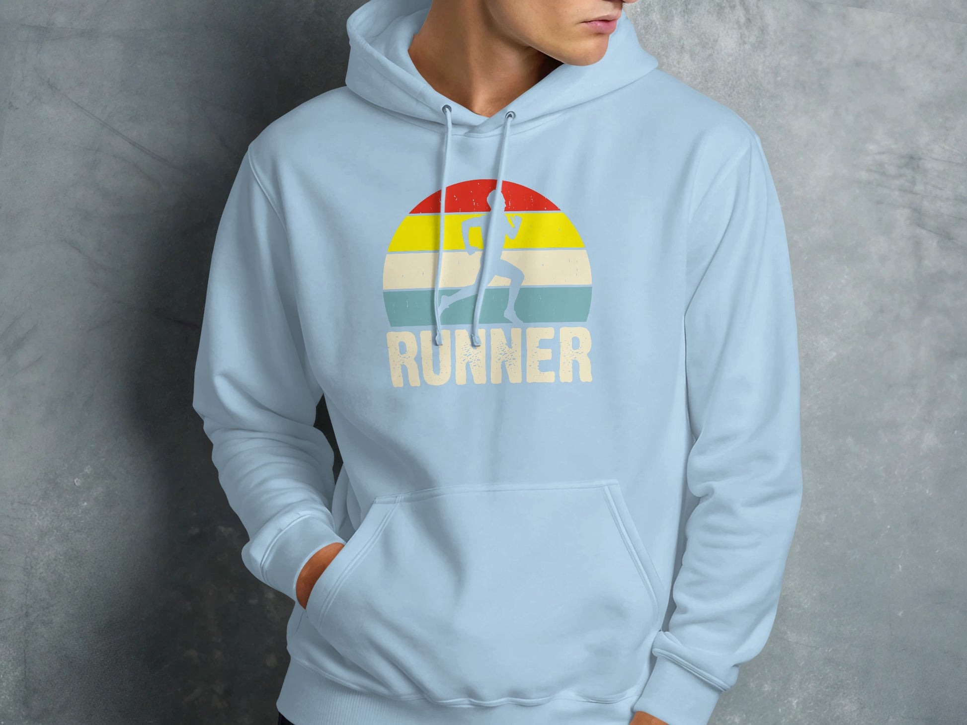 Light blue hoodie with a distressed graphic of a runner and the word "RUNNER" against a sunset.