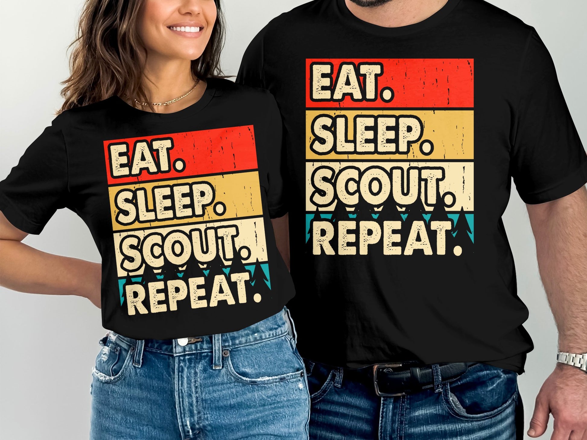 Black t-shirts with "Eat. Sleep. Scout. Repeat." text in distressed red, yellow, and blue.