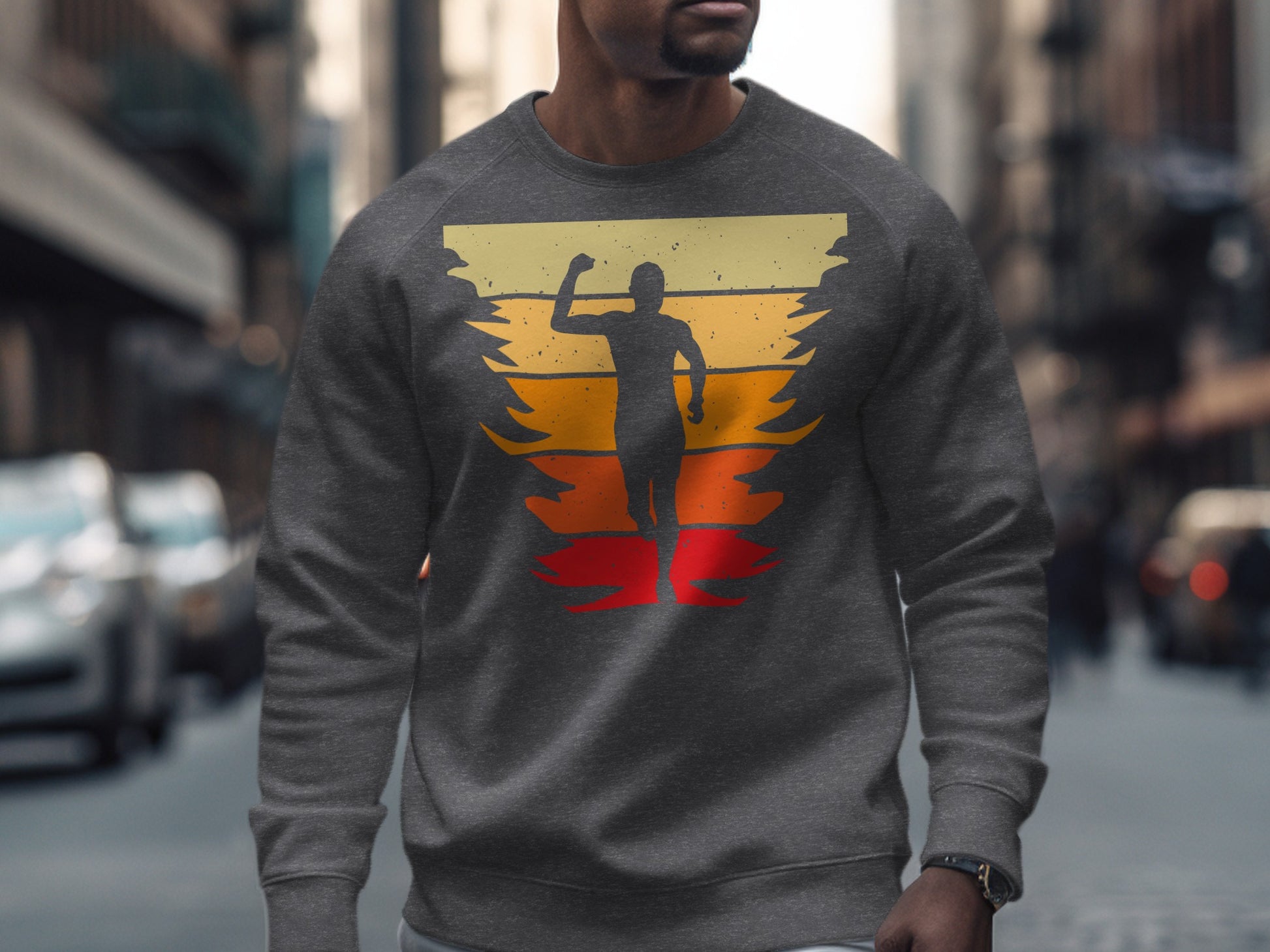 Gray sweatshirt with silhouette of runner against colorful sunset stripes.