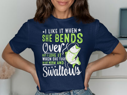 Navy t-shirt with green text and fish graphic reading "I like it when she bends over, but I love it when she tugs on my worm and swallows."
