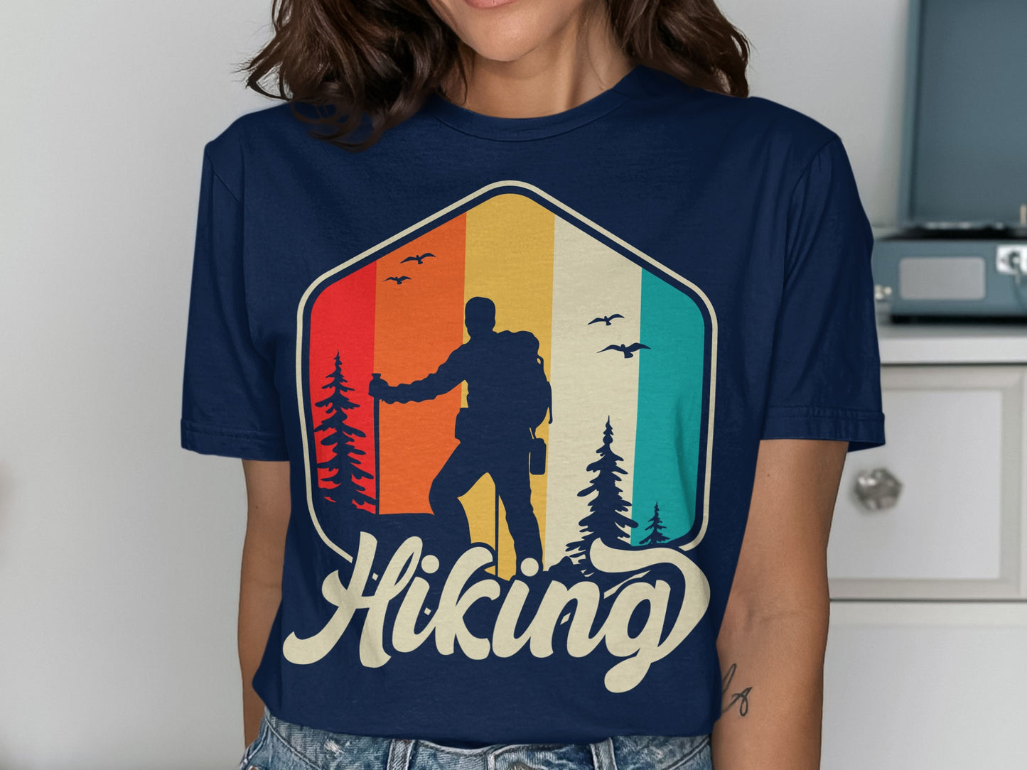 Silhouette of hiker with backpack against colorful sunset sky, text reads "Hiking".