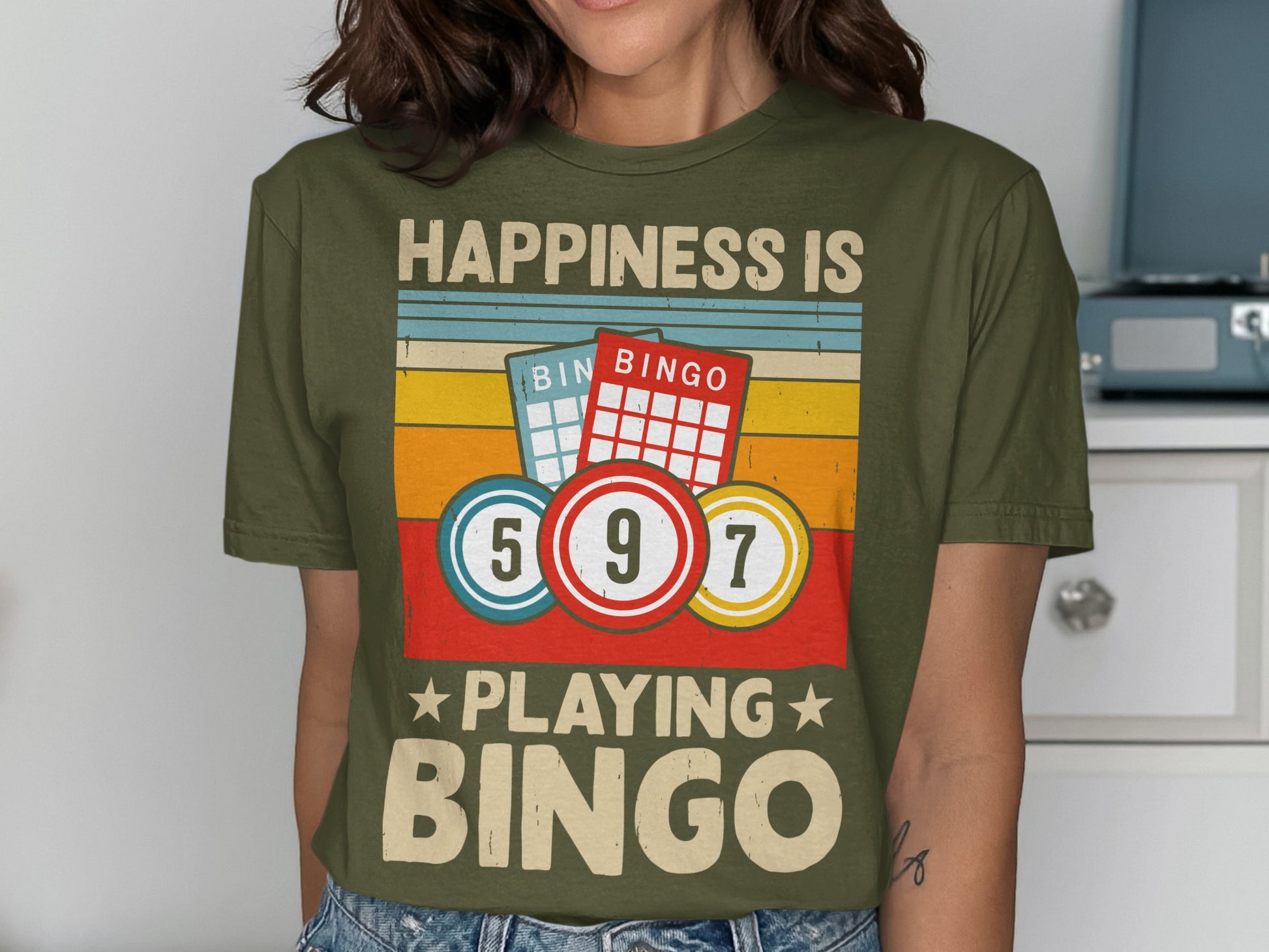 Green t-shirt with "Happiness is Playing Bingo" and bingo cards and balls.