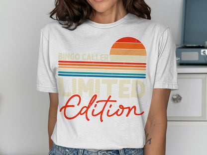 White t-shirt with "BINGO CALLER LIMITED Edition" and a retro sunset graphic.