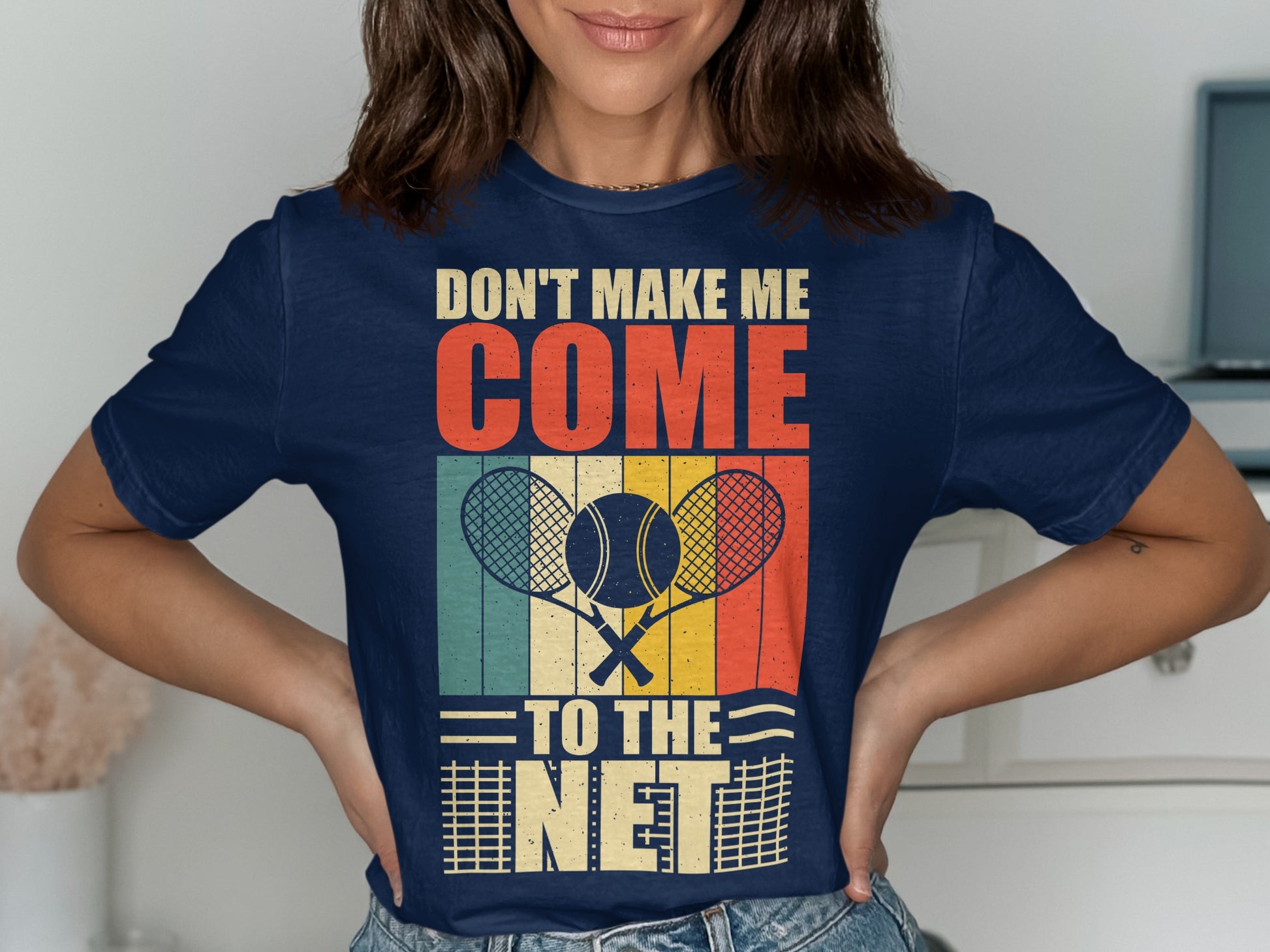 Navy t-shirt with "Don't Make Me Come To The Net" text and tennis rackets.