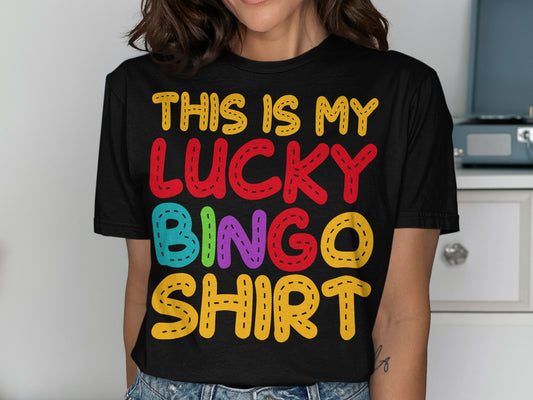 Black t-shirt with "THIS IS MY LUCKY BINGO SHIRT" in colorful letters.