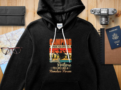 Gildan hoodie with "Camping: Where You Spend a Small Fortune to Live Like a Homeless Person" text.