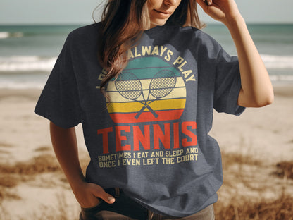 Dark t-shirt with vintage tennis rackets and text about playing tennis.