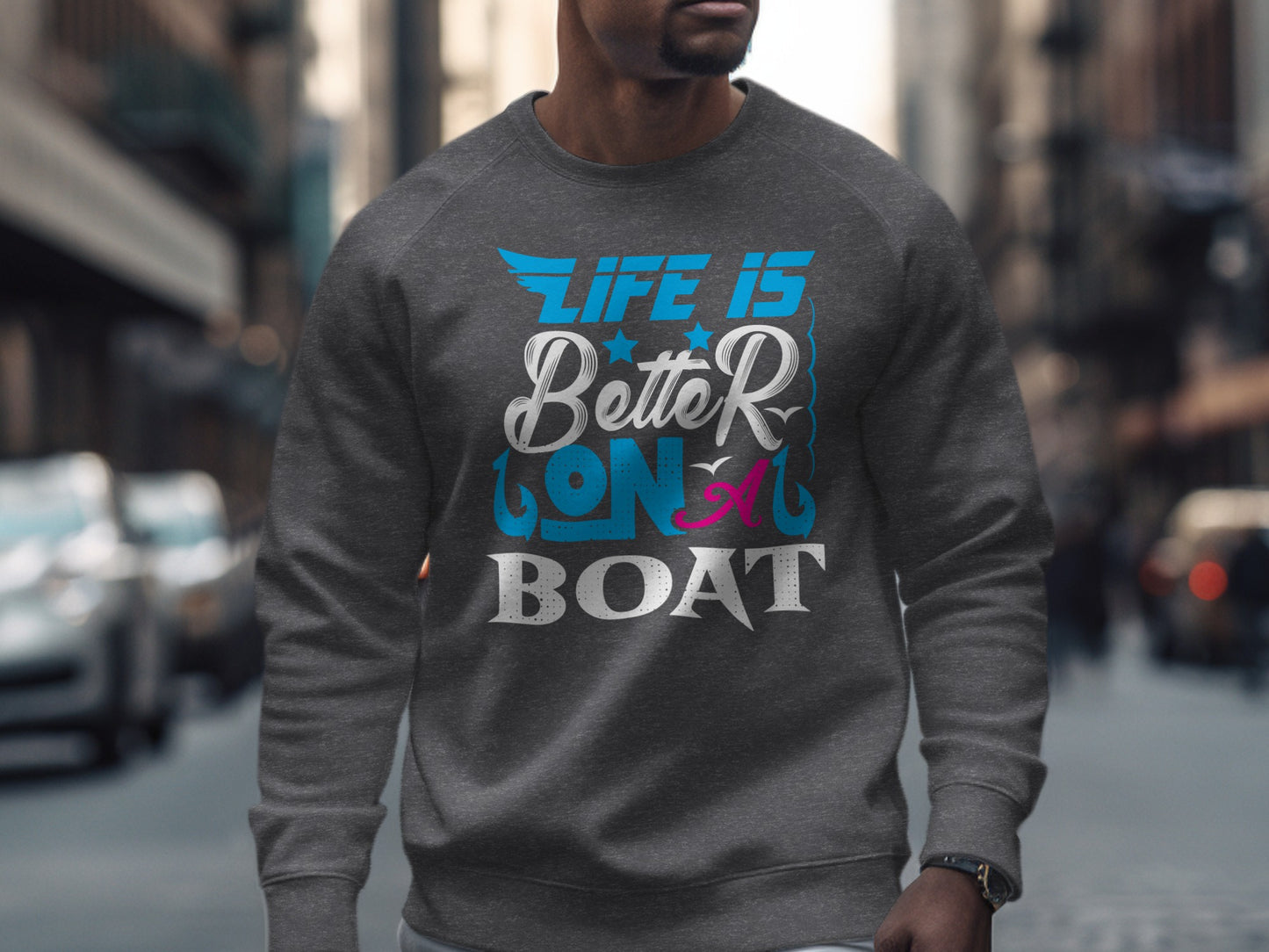 Gray sweatshirt with "Life is Better on a Boat" graphic text.