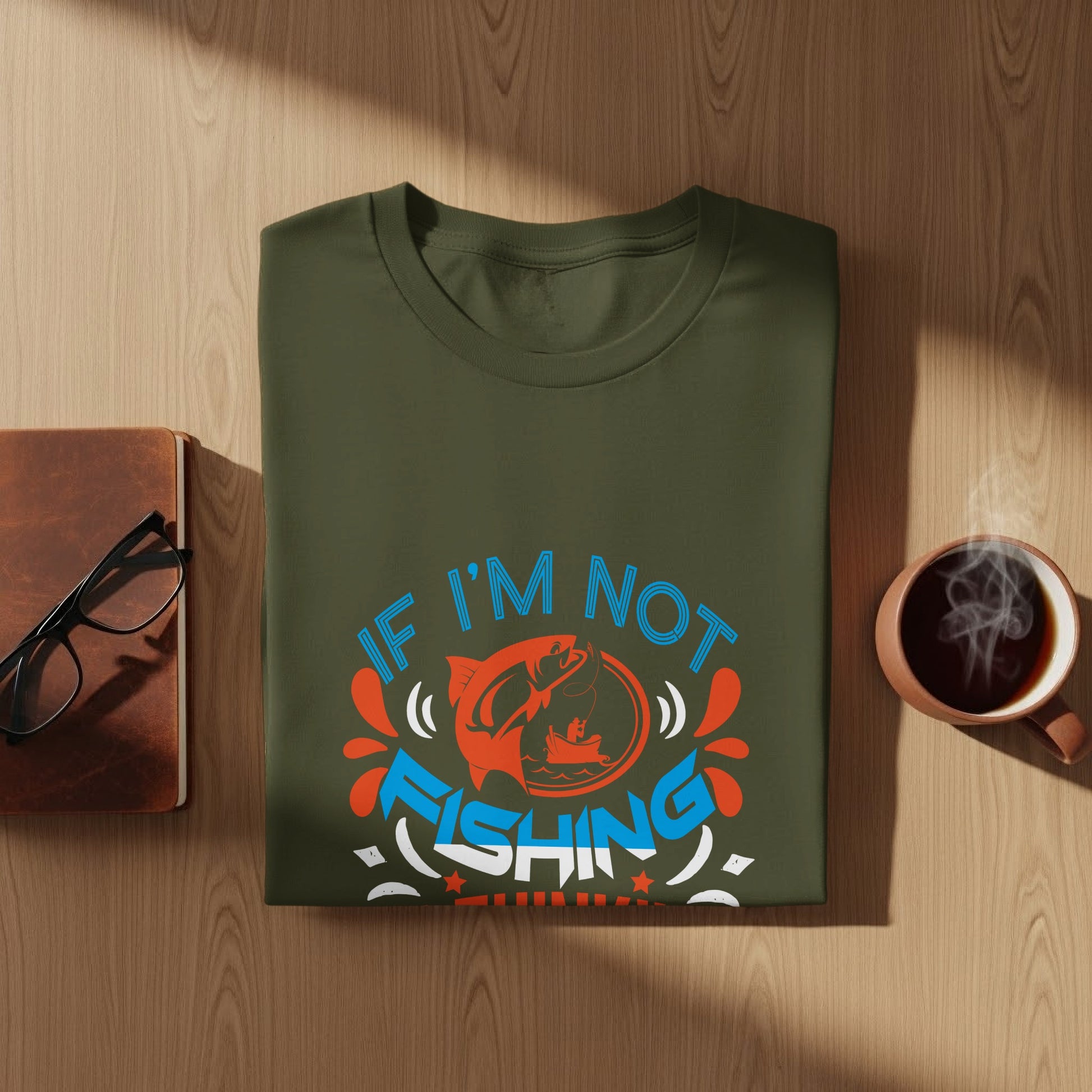 Green t-shirt with "If I'm not fishing I'm thinking about fishing" graphic.