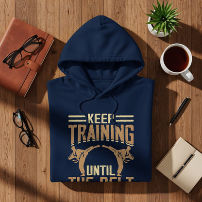 Navy hoodie with "Keep Training Until the Belt" text and graphic.