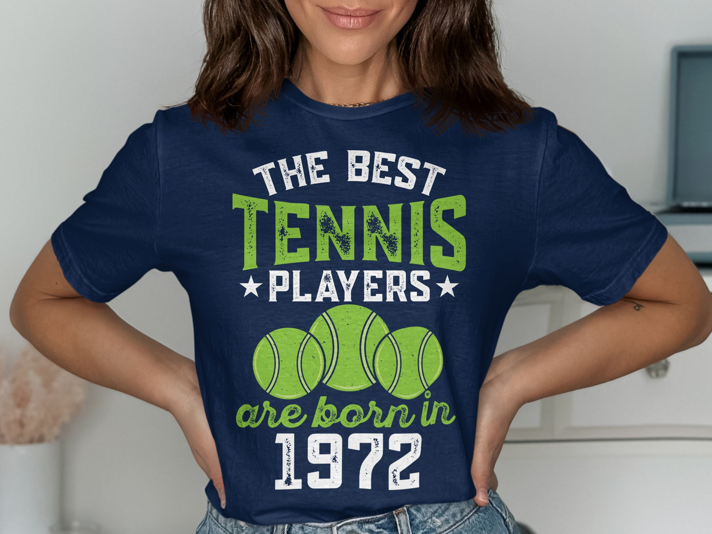 Navy t-shirt with "The best tennis players are born in 1972" and tennis balls.
