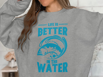 Gray sweatshirt with blue text "LIFE IS BETTER IN THE WATER" and a leaping fish design.