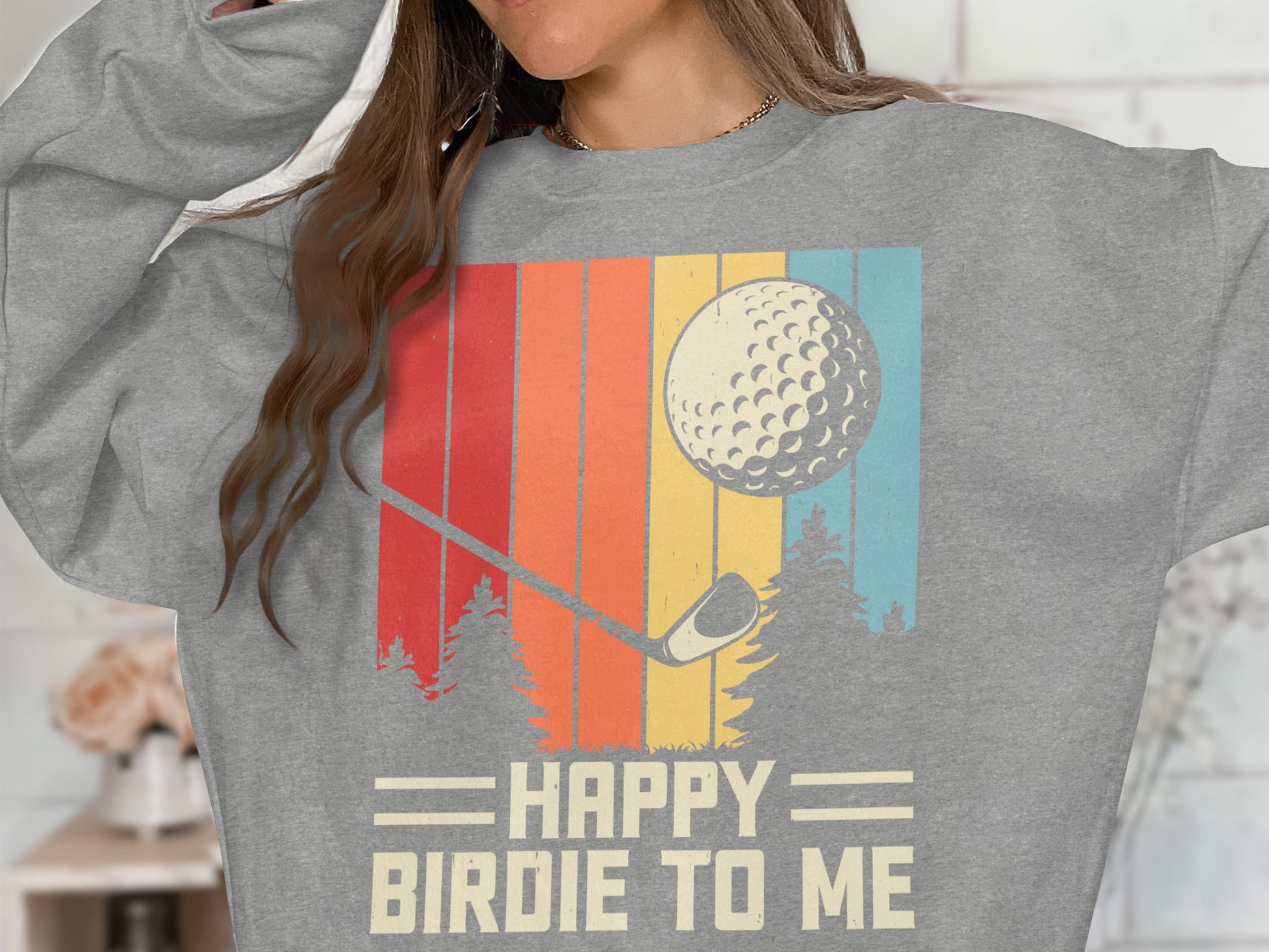 Gray sweatshirt with "HAPPY BIRDIE TO ME" text, golf ball, and vintage stripes.