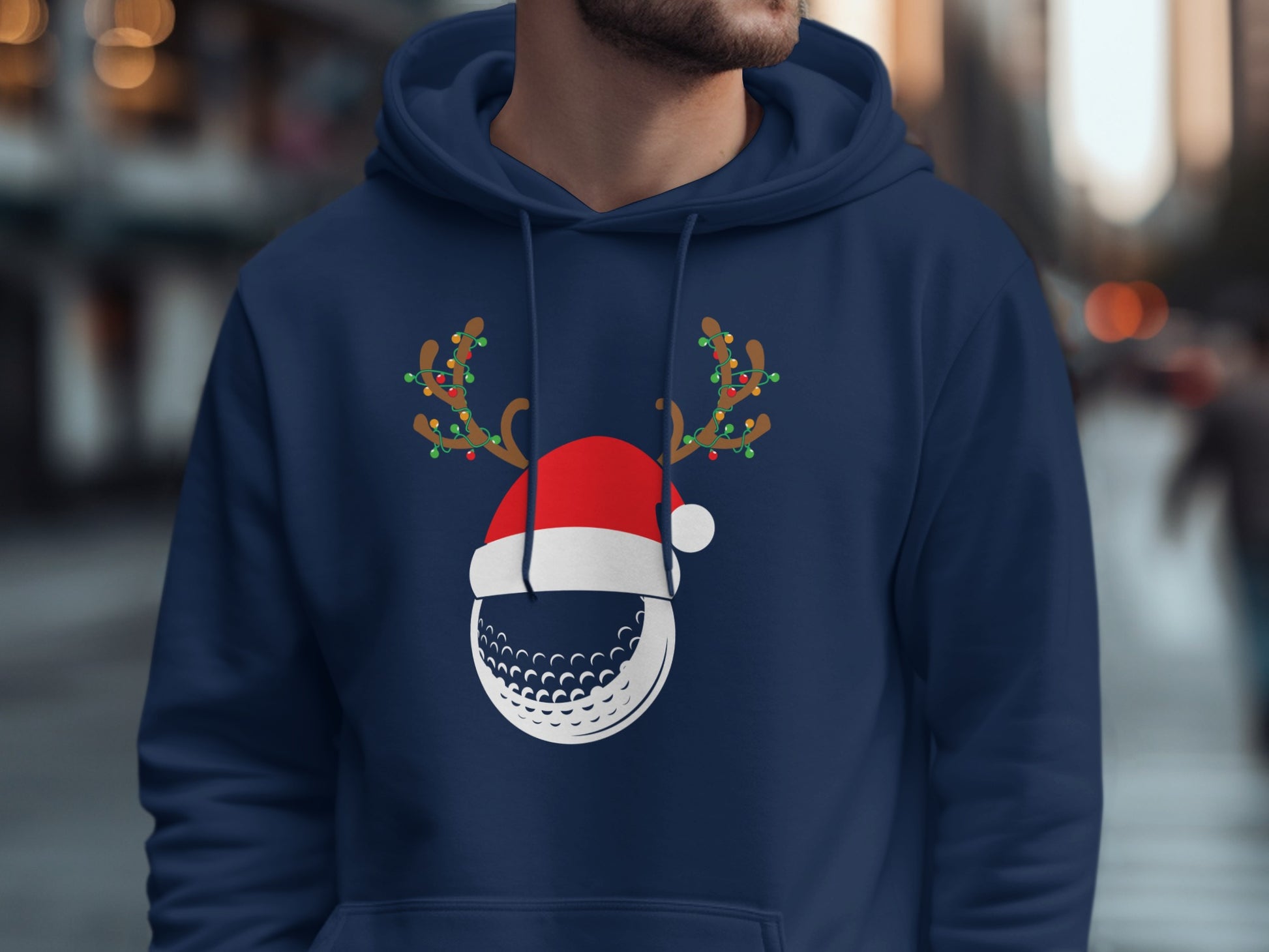 Navy blue hoodie with a golf ball wearing a Santa hat and reindeer antlers.