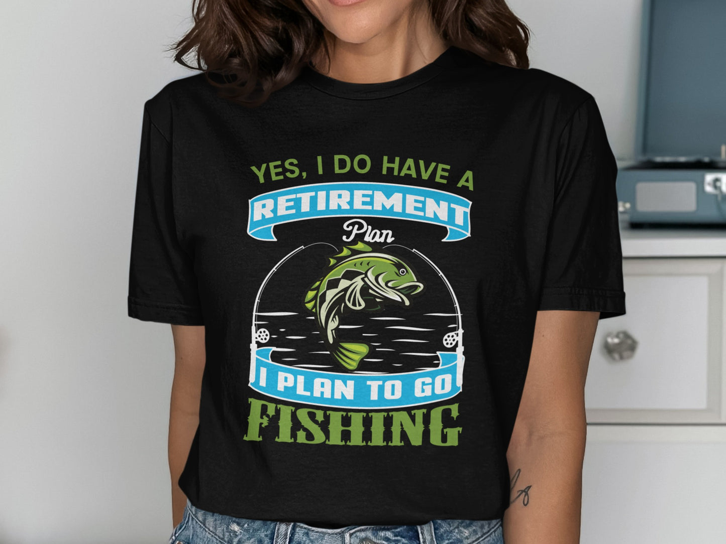 T-shirt with "Yes, I Do Have a Retirement Plan, I Plan to Go Fishing" text and fish.