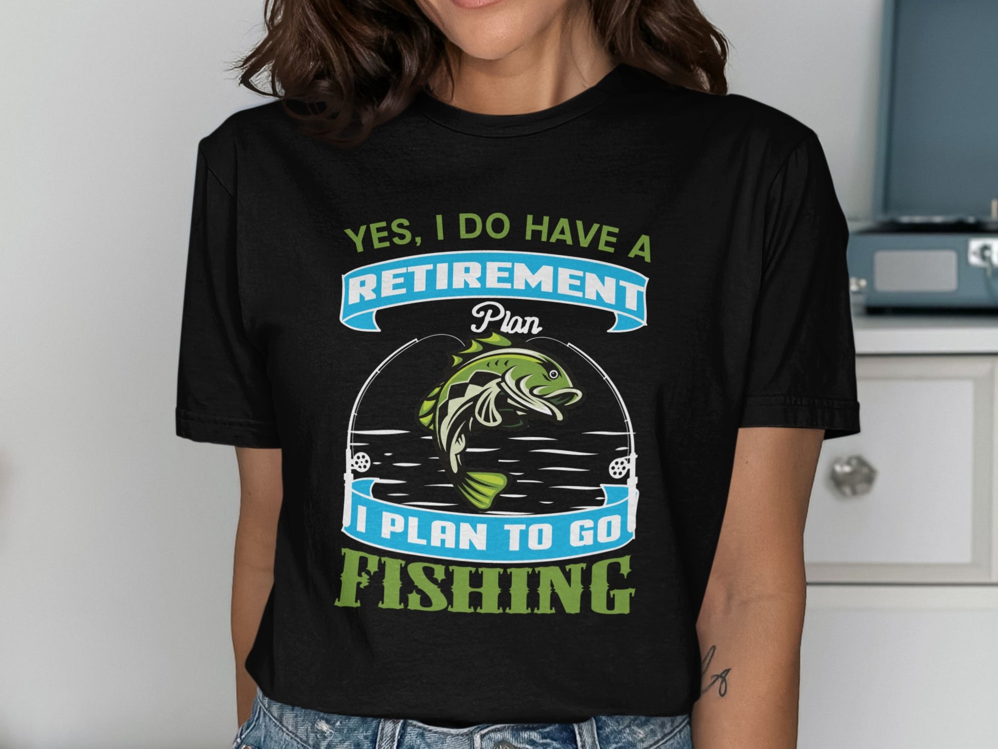 T-shirt with "Yes, I Do Have a Retirement Plan, I Plan to Go Fishing" text and fish.