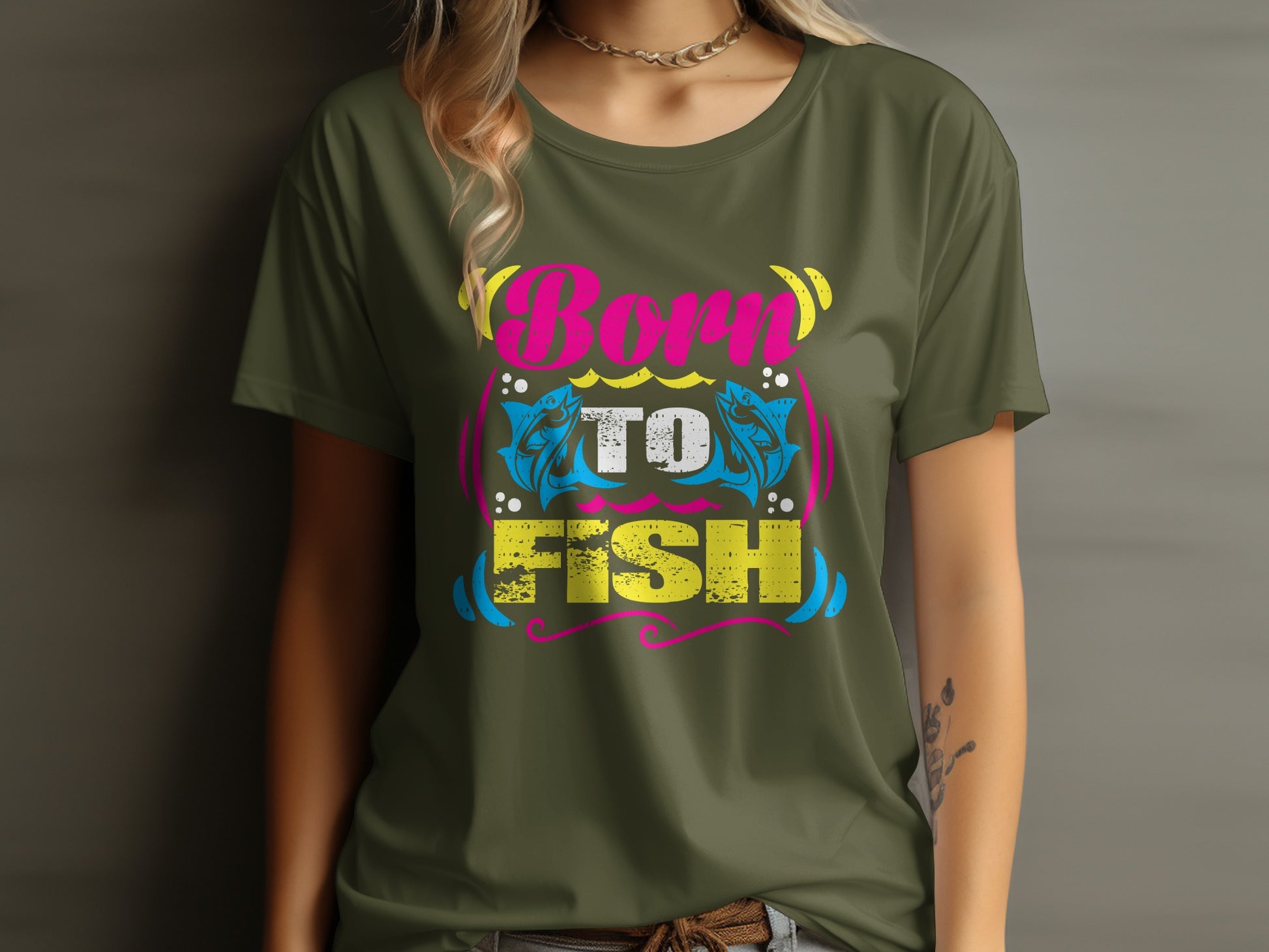 Green t-shirt with "Born to Fish" text and fish graphics.