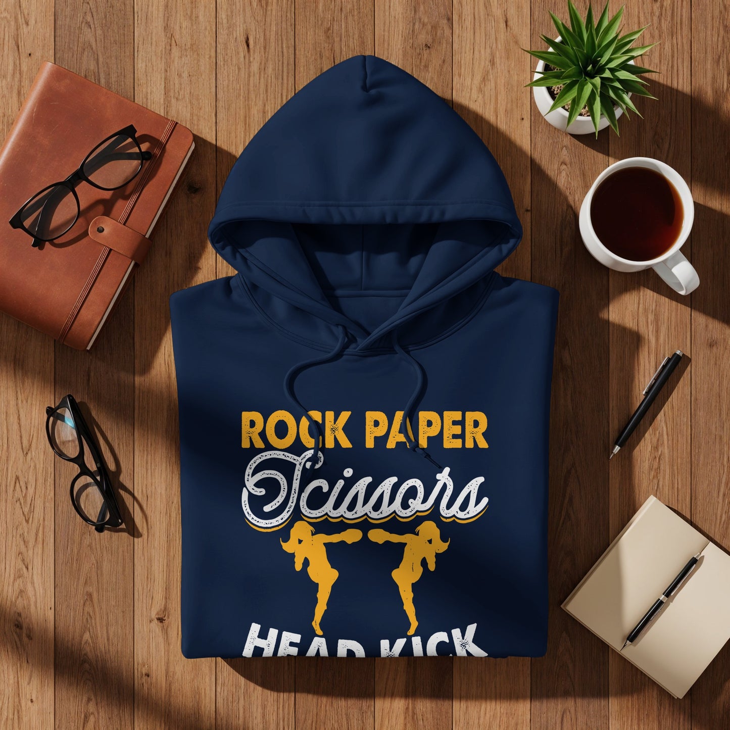 Navy hoodie with "Rock Paper Scissors Head Kick" text and cartoon figures.