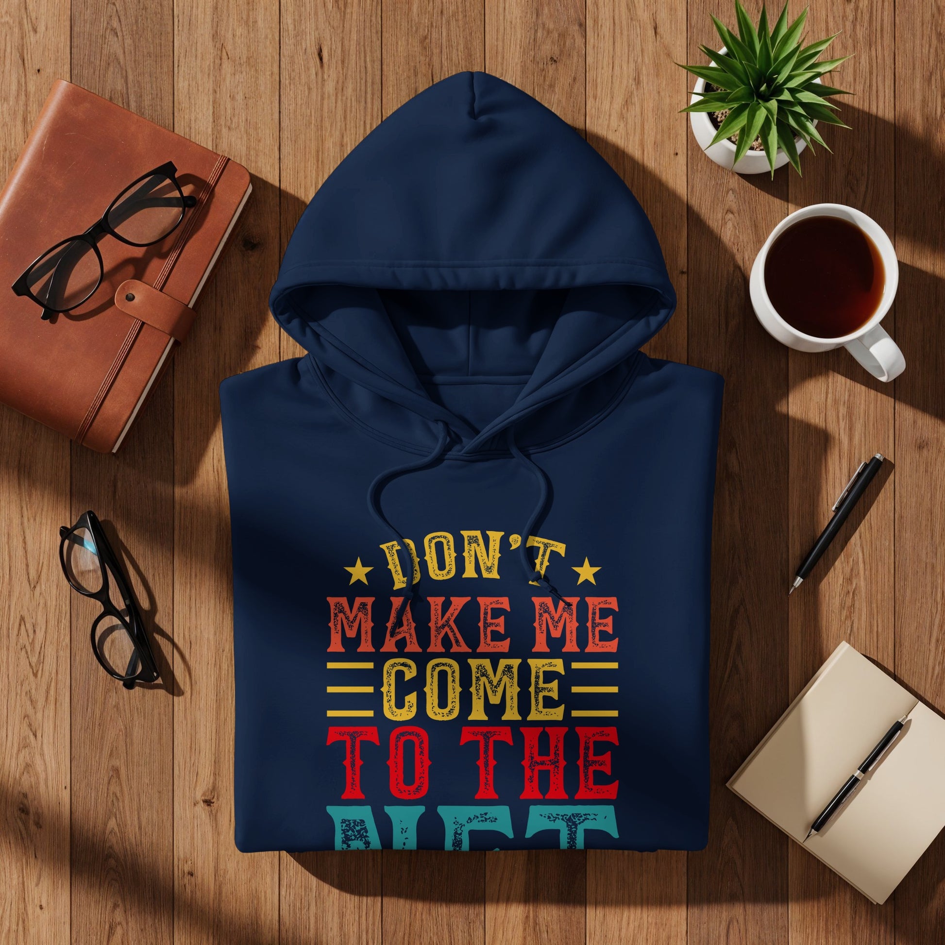 Navy hoodie with colorful text that reads "Don't Make Me Come To The Night".