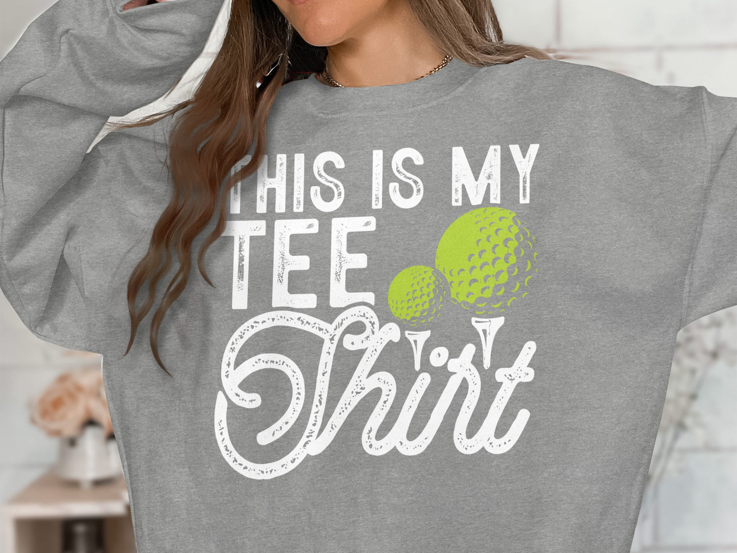 Gray sweatshirt with "THIS IS MY TEE Shirt" and two golf balls.