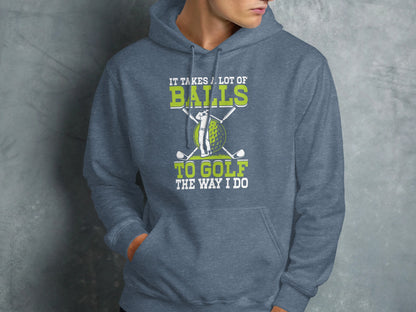 Grey hoodie with golf balls, clubs, and text "It takes a lot of balls to golf the way I do".