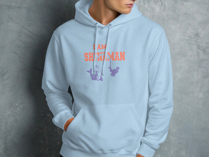 Light blue hoodie with "I AM SHMAN" text and fishing graphic.