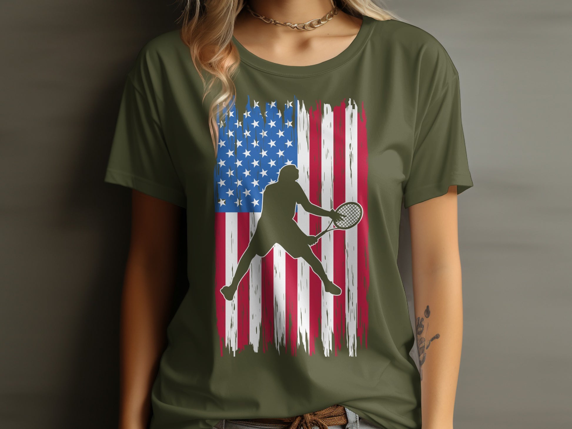 Tennis player silhouette against distressed American flag design on olive green t-shirt.