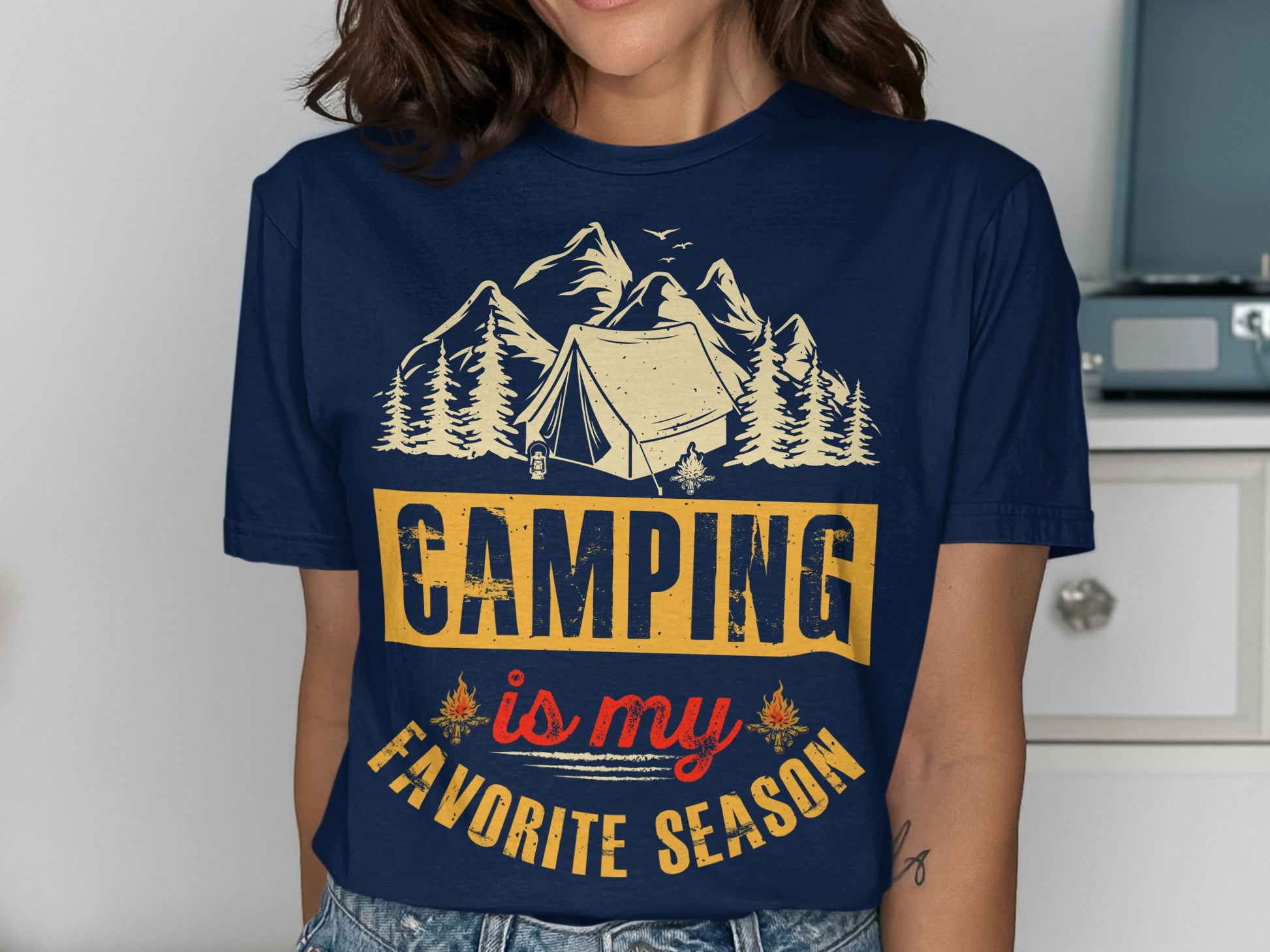 Navy t-shirt with "Camping is my favorite season" text and mountain graphic.