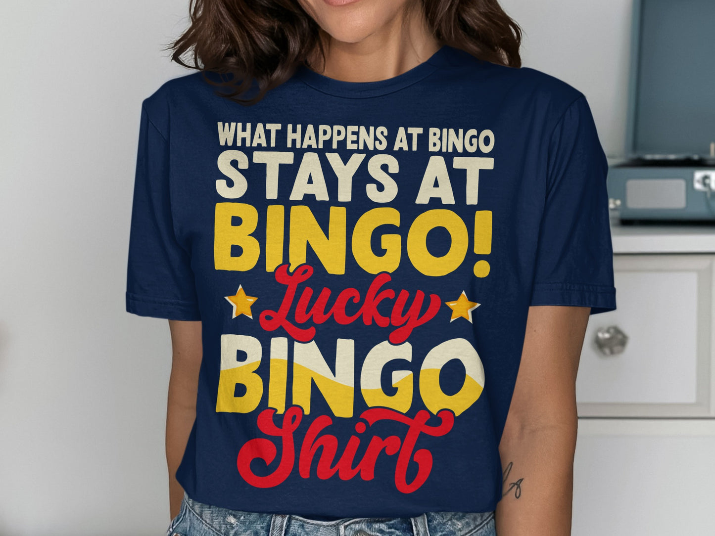 Navy t-shirt with "What Happens At Bingo Stays At Bingo! Lucky Bingo Shirt" text.
