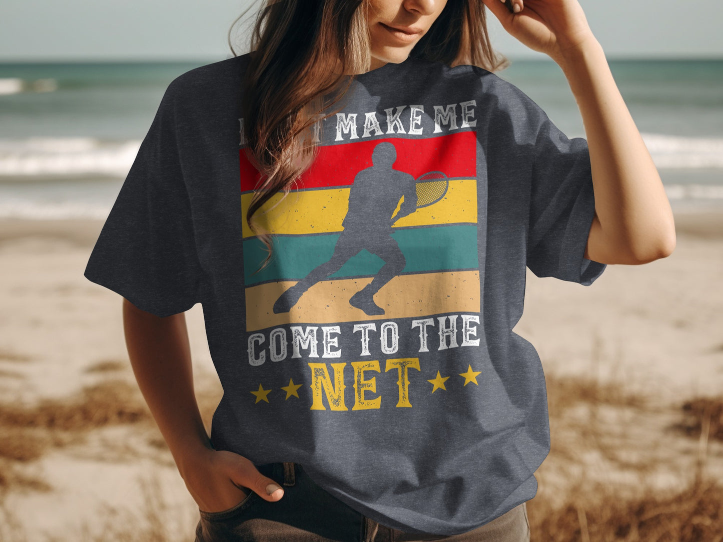 Dark t-shirt with graphic of tennis player and text "LET ME MAKE ME COME TO THE NET".