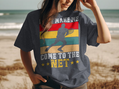 Dark t-shirt with graphic of tennis player and text "LET ME MAKE ME COME TO THE NET".