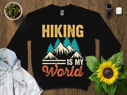 Black sweatshirt with "Hiking is my World" text and mountain graphic.