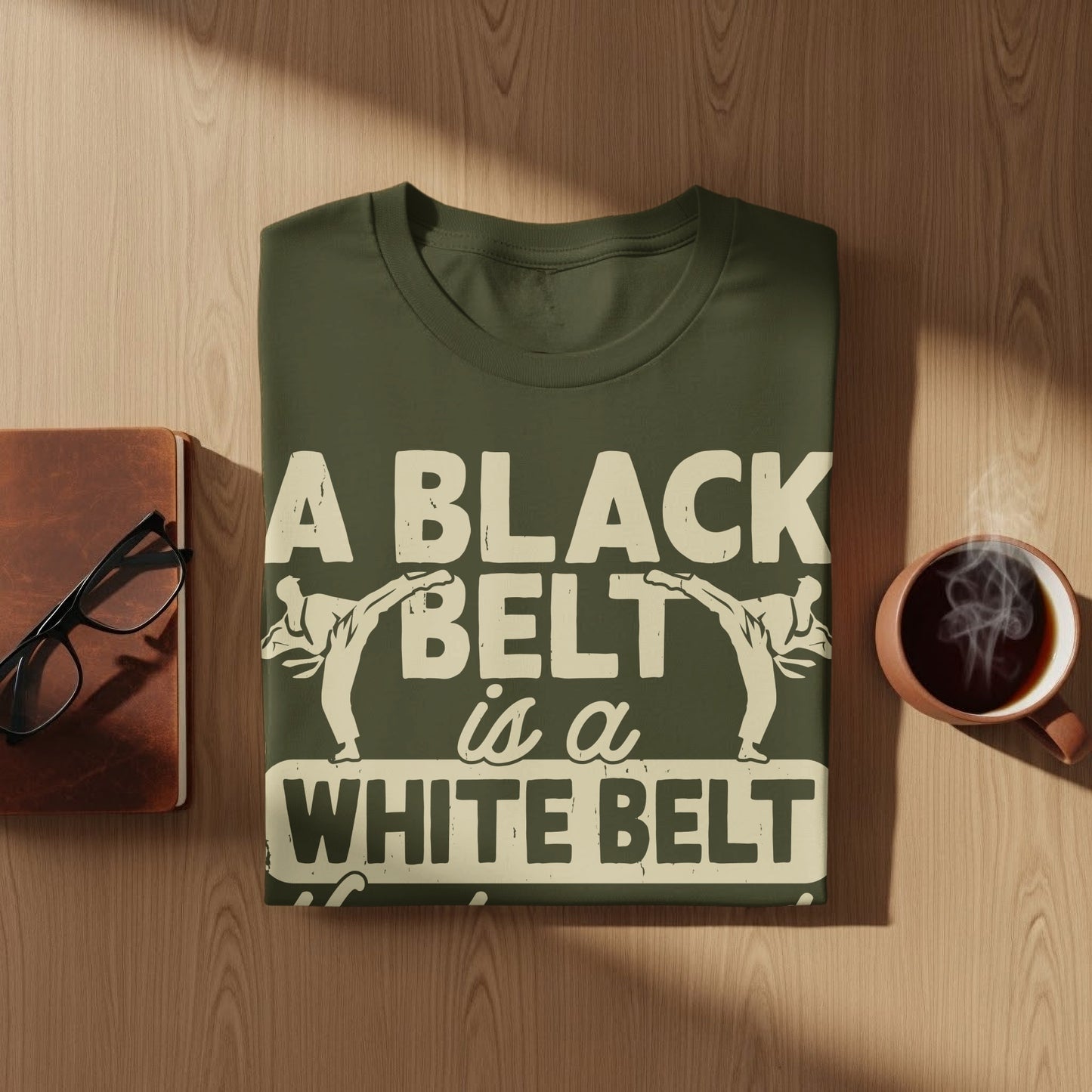 Dark green t-shirt with white text and karate graphics.