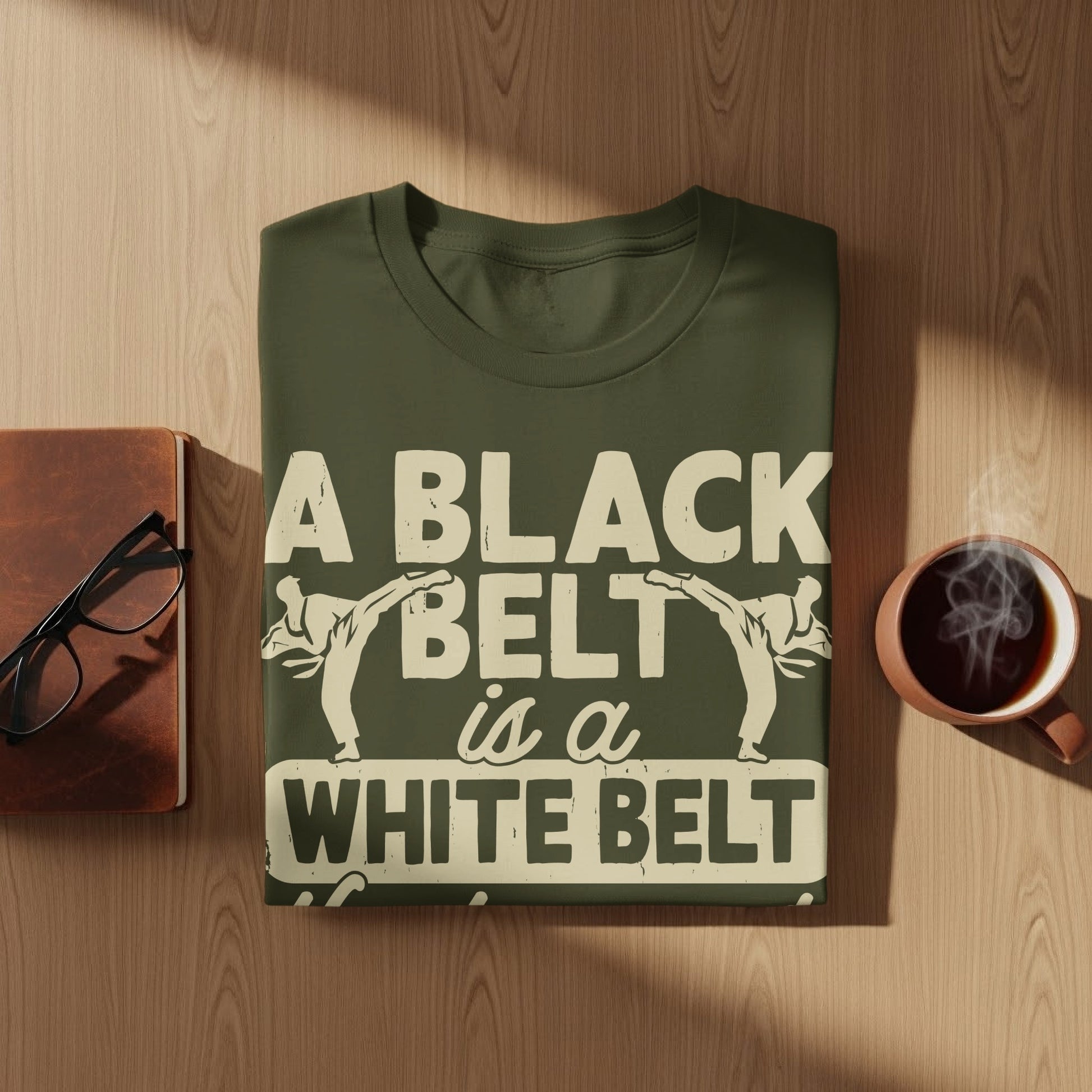 Dark green t-shirt with white text and karate graphics.