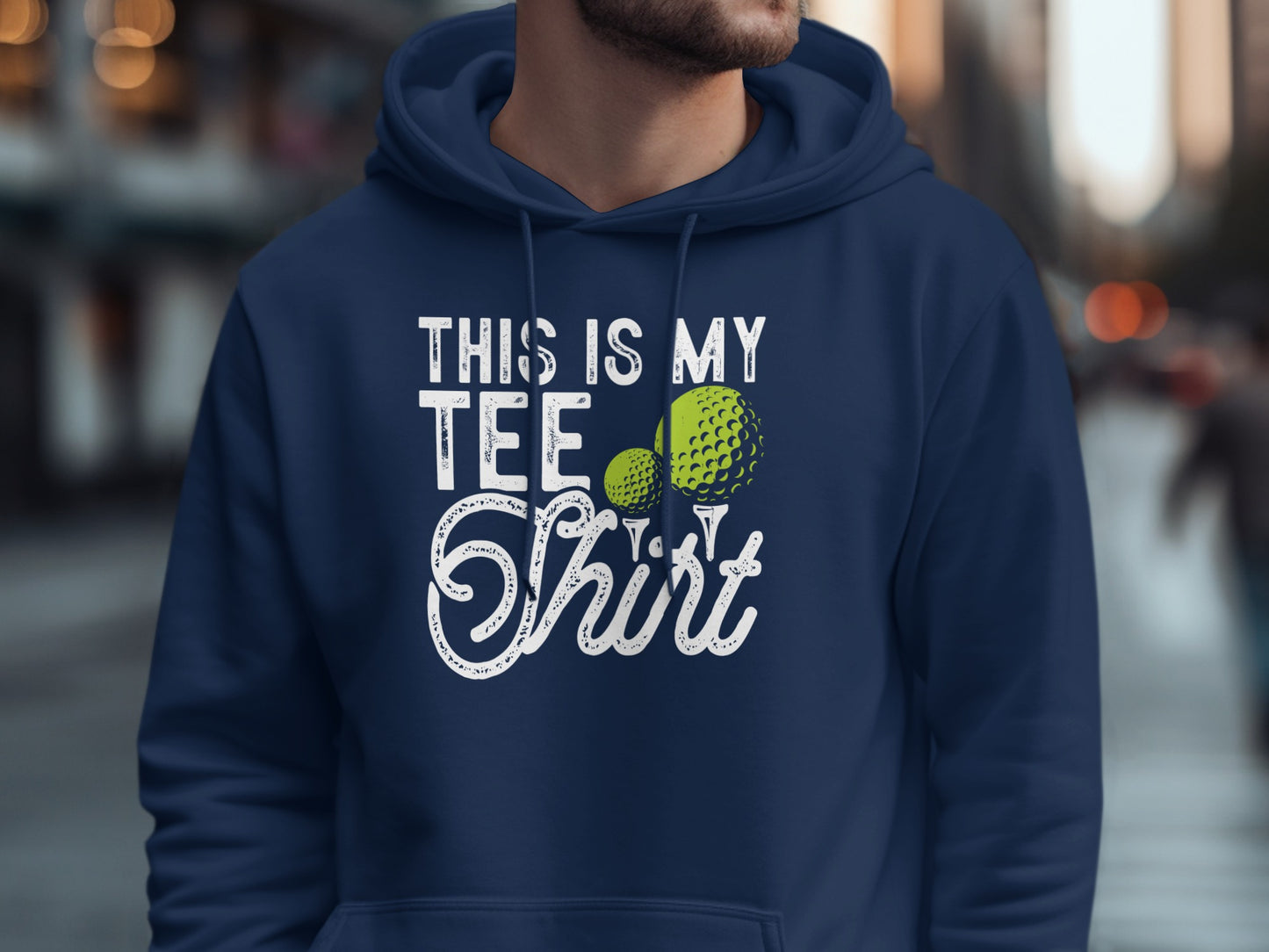 Navy hoodie with "This is my tee shirt" text and two golf balls.