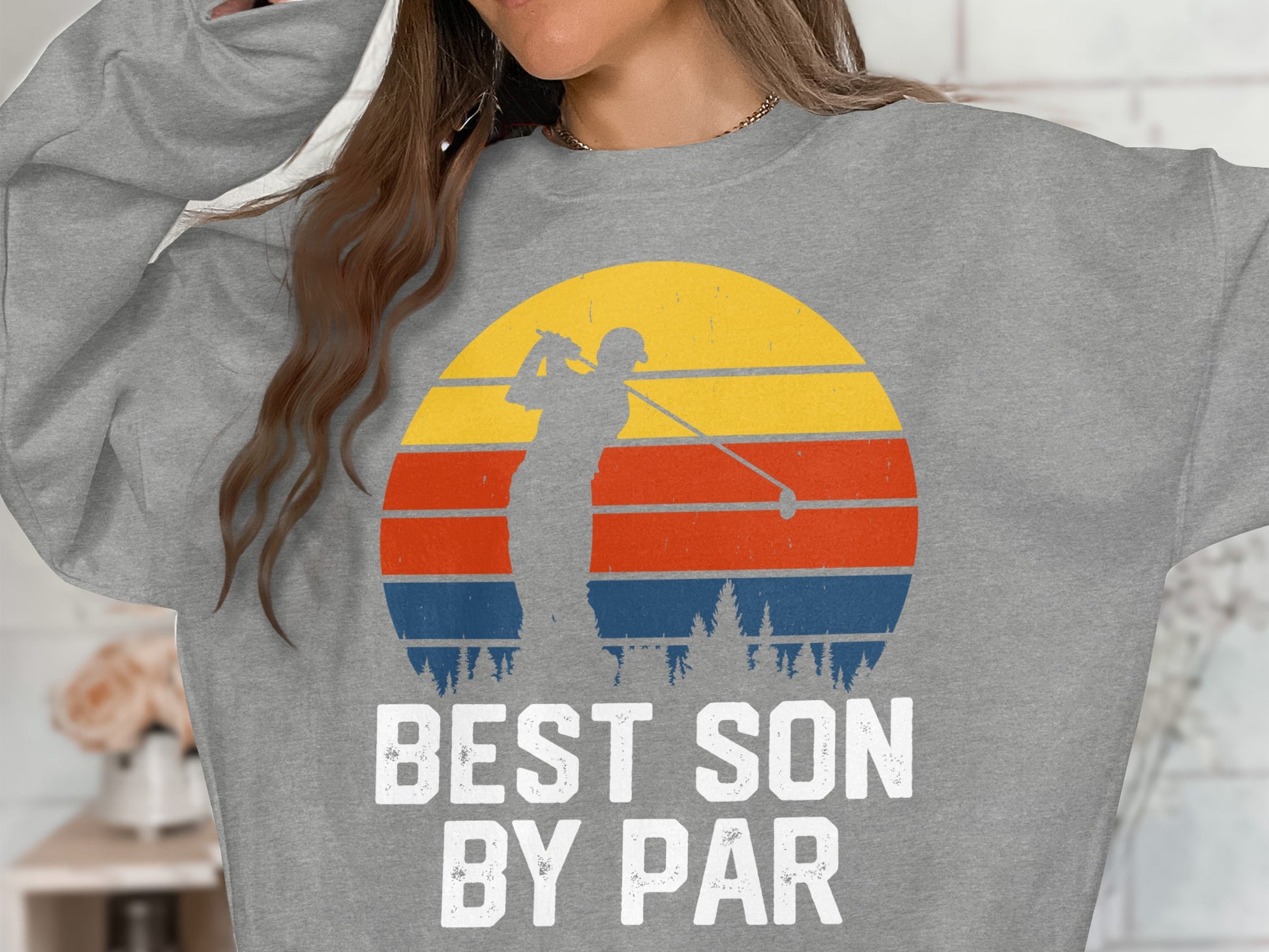 Gray sweatshirt with a retro sunset graphic and "BEST SON BY PAR" text.