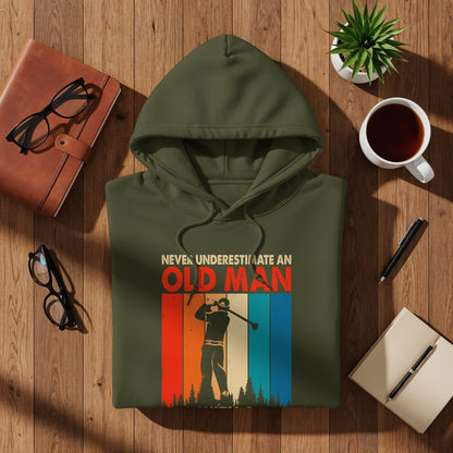 Olive green hoodie with "Never Underestimate An Old Man" graphic and golf design.