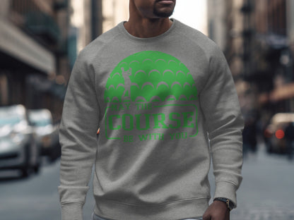 Gray sweatshirt with green golf ball pattern and "May the course be with you" text.