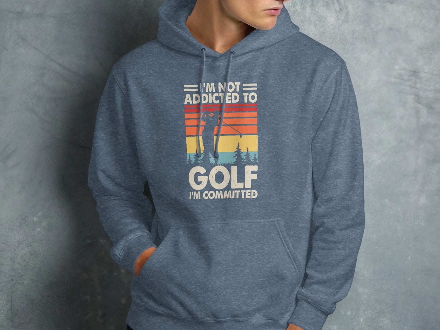 Blue hoodie with text "I'M NOT ADDICTED TO GOLF I'M COMMITTED" and golf graphic.