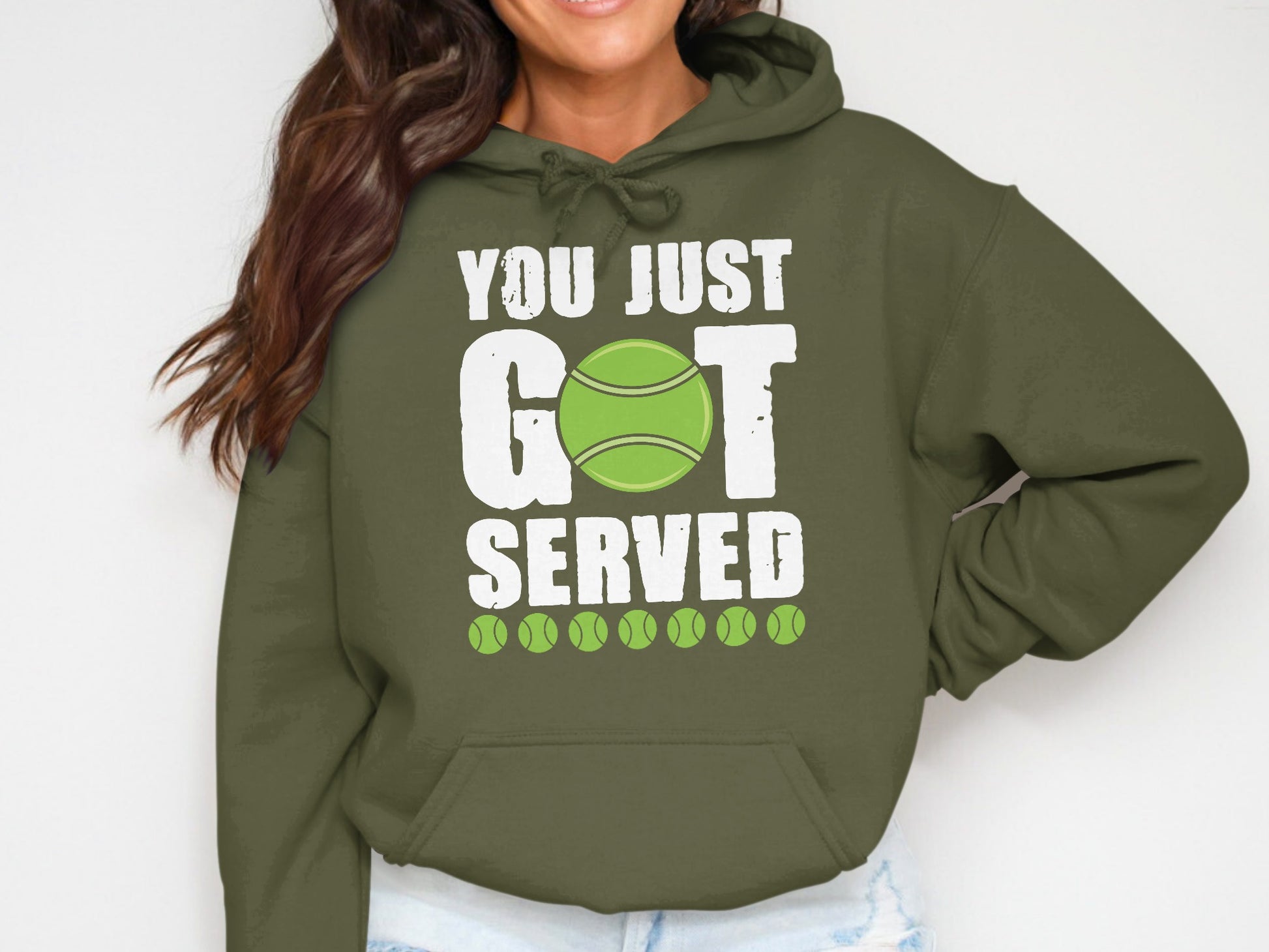 Olive green hoodie with "YOU JUST GOT SERVED" text and tennis ball graphic.
