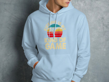 Light blue hoodie with "KICKING IS MY GAME" text and sunset graphic.