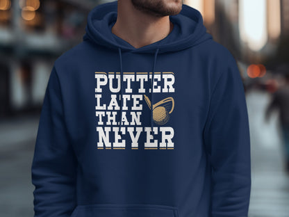 Navy hoodie with "Putter Late Than Never" text and golf club graphic.