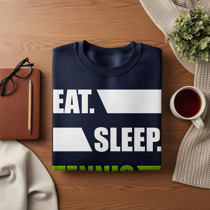 Navy sweatshirt with white text "EAT. SLEEP. REPEAT." on a wooden surface.